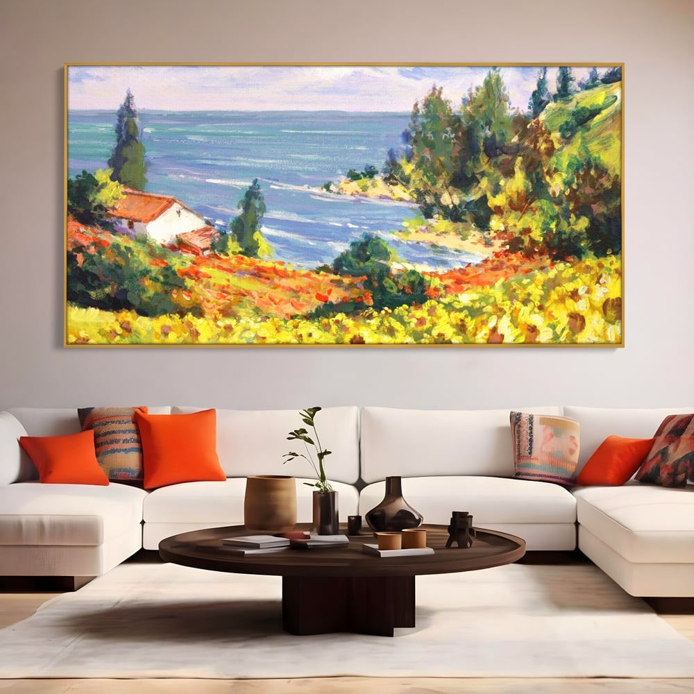 Tablou canvas cu pictura camp cu floarea soarelui si mare, in rama de aluminiu auriu, pe perete intr-un living